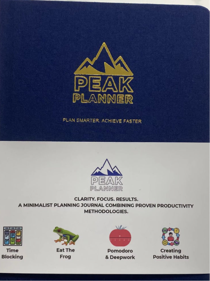 Peak Planner A5 navy blue hard cover with gold logo and methodology band